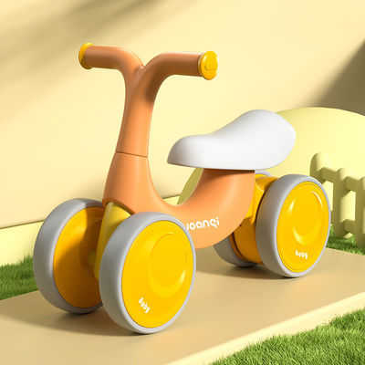 オレンジプラスチックベビーウォーカー バランスカー サイレントローラースケートとグリーンデザイン