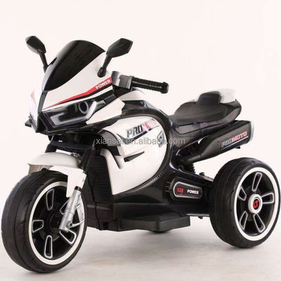 白い子供用電動モーターサイクルの三輪車 彩色の光と380*2モーター